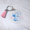 Llavero acrílico Stitch con flores
